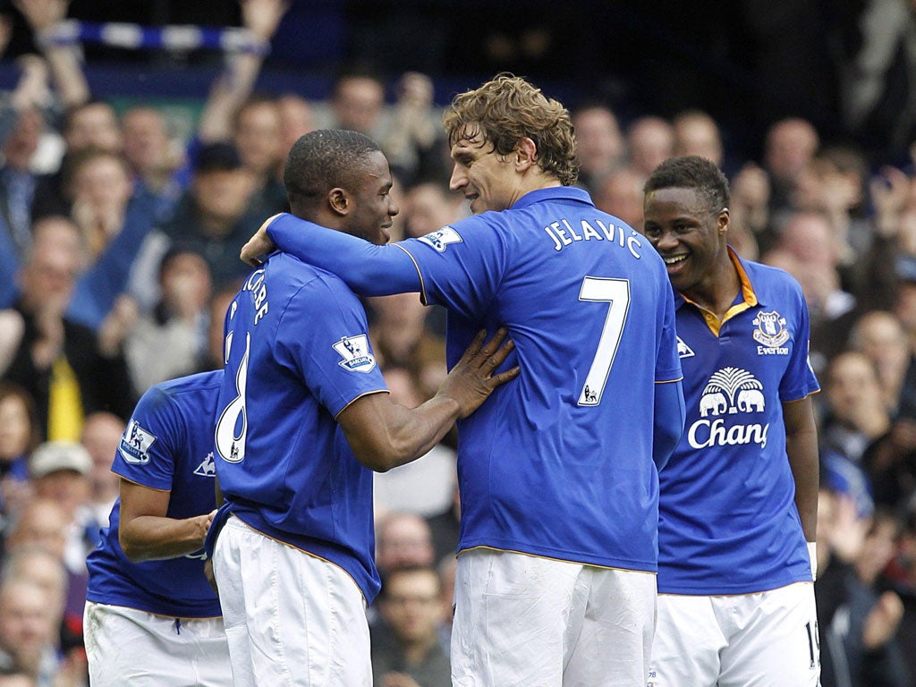 Game over: Victor Anichebe (left) celebrates after scoring for Everton