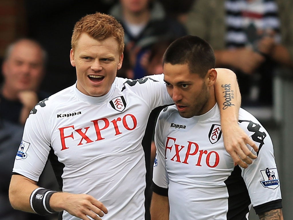 Texas star: John Arne Riise (right) and Clint Dempsey celebrate Fulham's opener