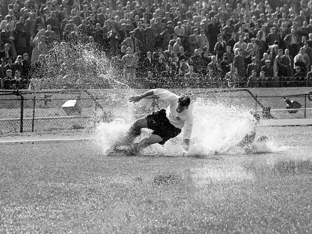 The iconic image of Tom Finney aqua-planing at Stamford Bridge in 1956 hangs in the manager's office at Deepdale