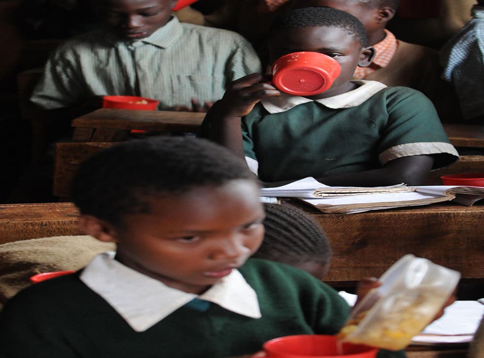 Ration Books: Pupils at a school in a Nairobi slum eat a meal provided by the World Food Programme
