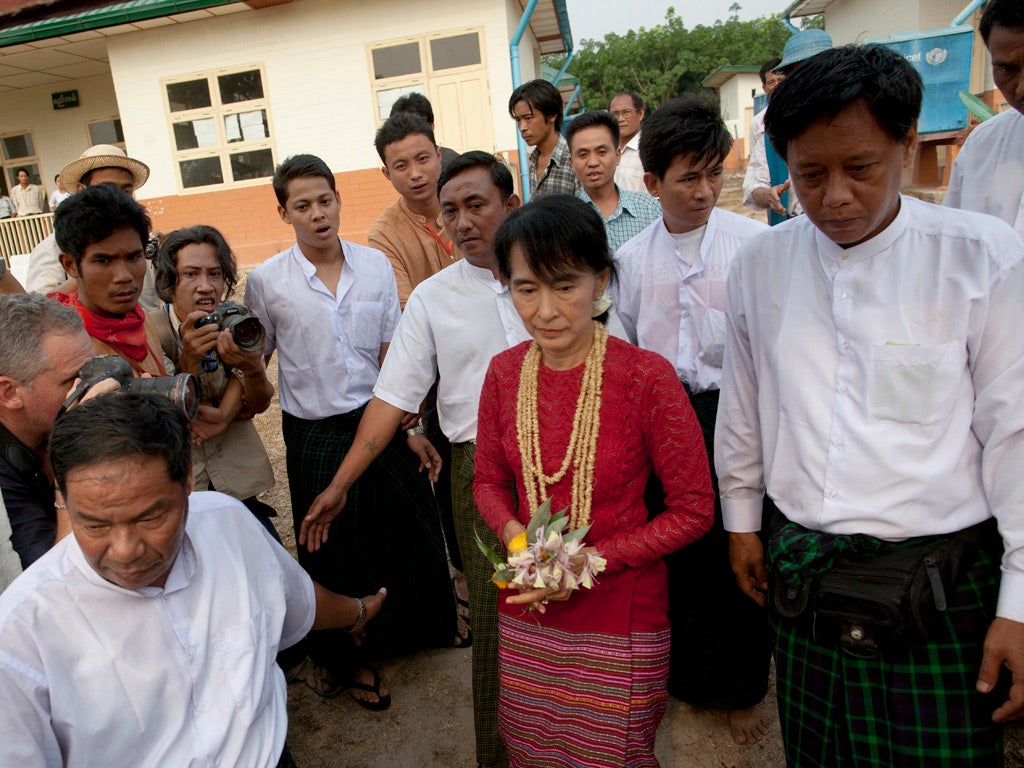 Aung San Suu Kyi visits polling stations in her constituency as Burmese vote in the parliamentary elections