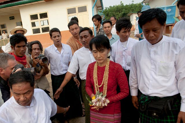 Aung San Suu Kyi visits polling stations in her constituency as Burmese vote in the parliamentary elections