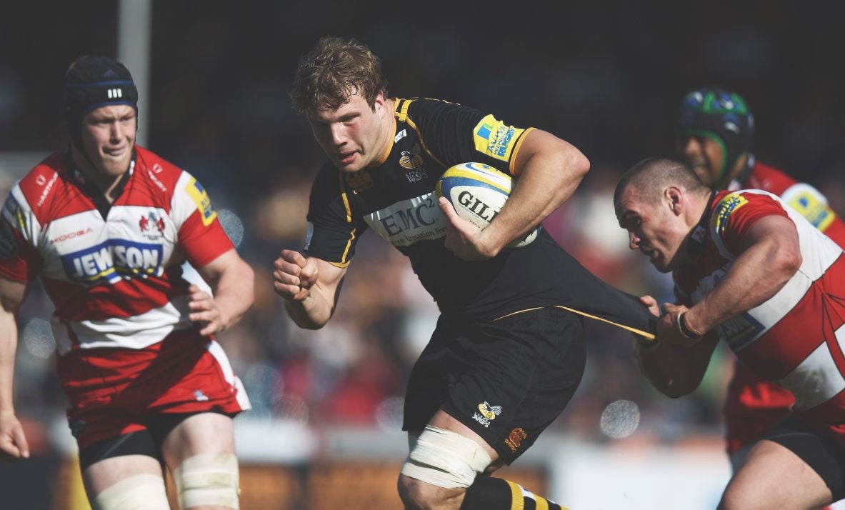 Gloucester’s Dan Murphy gets to grips with Joe Launchbury, of
Wasps, during a thriller at Adams Park yesterday