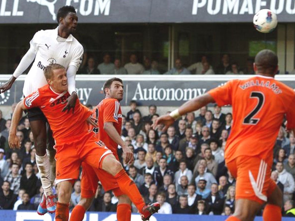 Emmanuel Adebayor nods in the second of his two goals during the
3-1 victory over Swansea