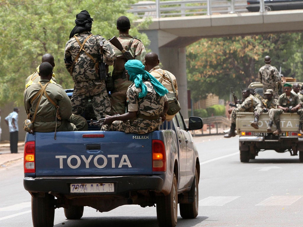 Malian junta soldiers patrol the streets of Kati, outside Mali's capital, Bamako