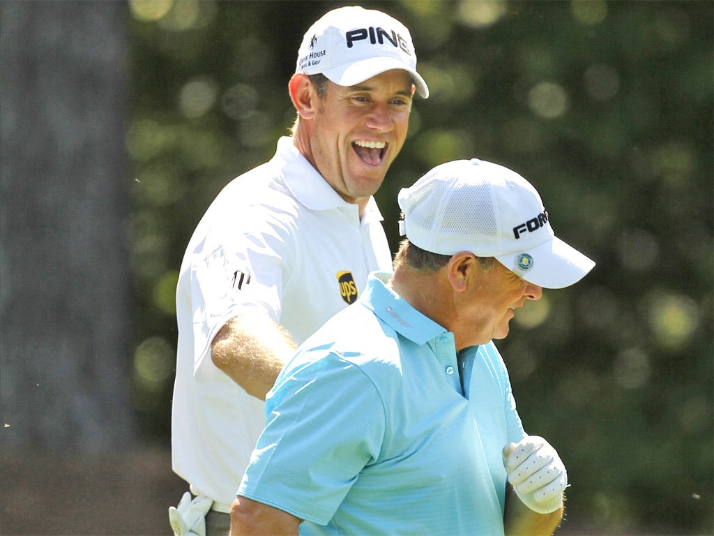 England's Lee Westwood (left) shares a joke with Ian Woosnam, of Wales, during a practice round at Augusta yesterday