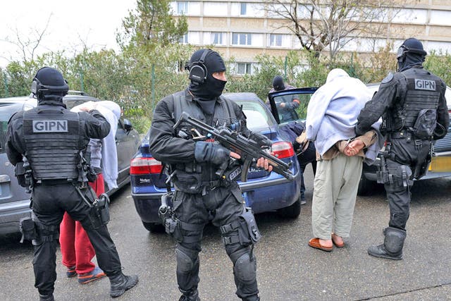 French members of the French National Police Intervention Group (GIPN) arrest suspected radical Islamists 