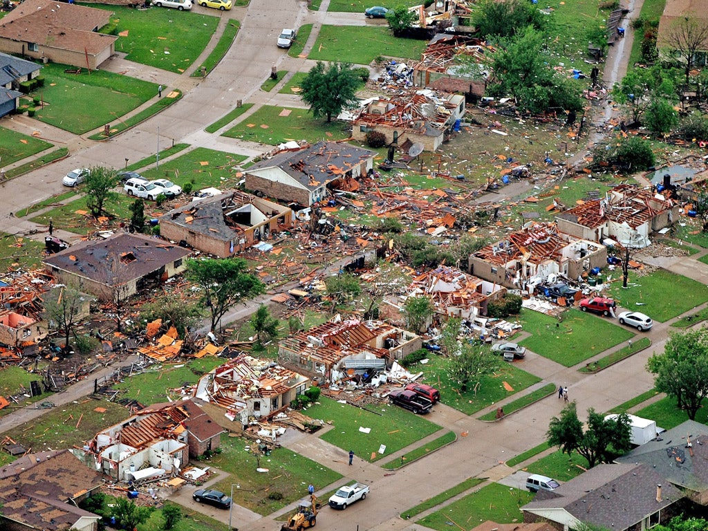 Homes in Lancaster, Texas lay destroyed by a tornado