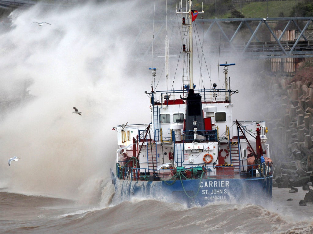 The grounded cargo ship MV Carrieris battered by waves after hitting rocks in Llanddulas, Wales
