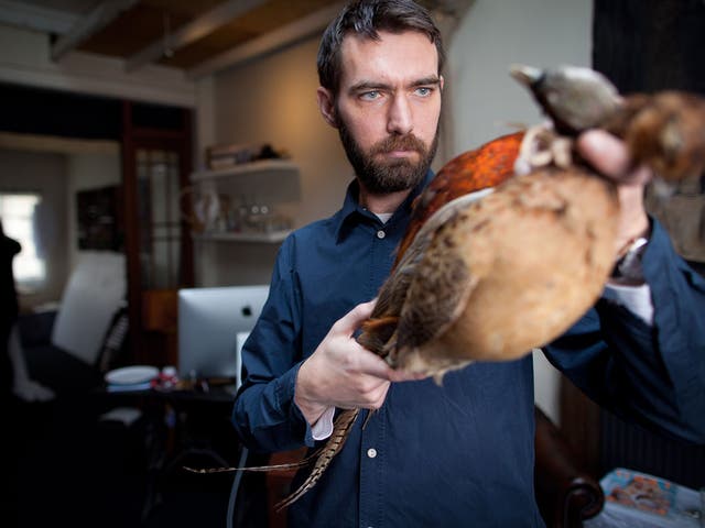 Lee Paton and pheasants at his studio in Islington