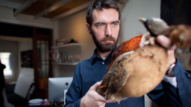 Lee Paton and pheasants at his studio in Islington