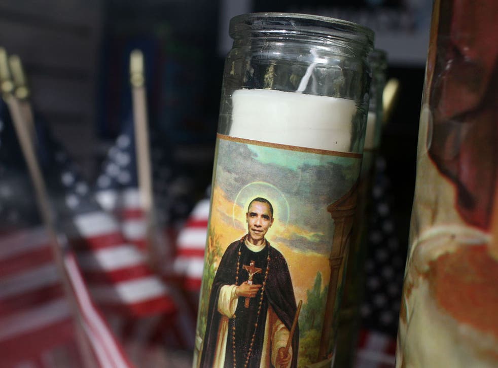 The President, given a saintly makeover on this votive candle, could be the first Oval Office resident in many years to finish a term without a major scandal
