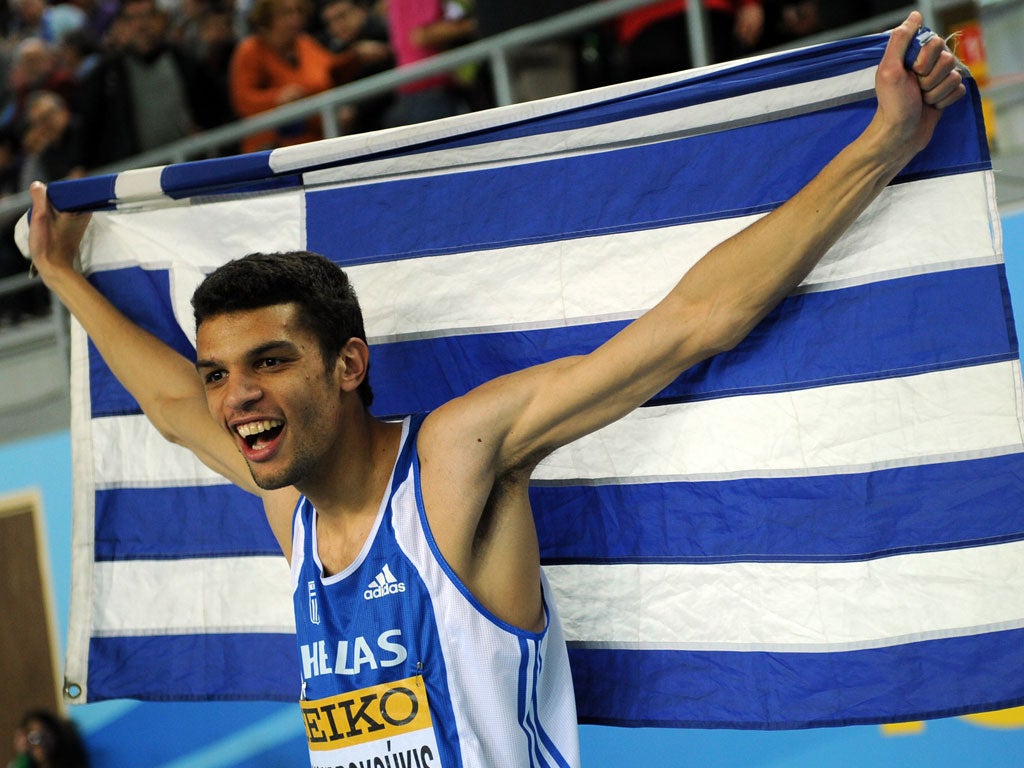 Leap of faith: Dimitrios Chondrokoukis won the world indoor high jump in Istanbul, but his father forbade Greek politicians from attending his homecoming
