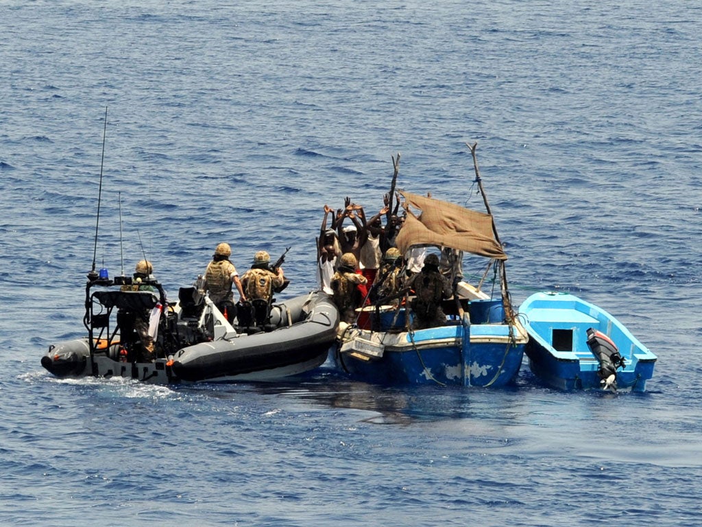 Marines from the Navy frigate HMS Portland intercepting and disarming pirates in the Gulf of Aden in 2009