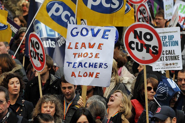 Teachers and lecturers held a one-day strike in London over staff and pension cuts in 2012