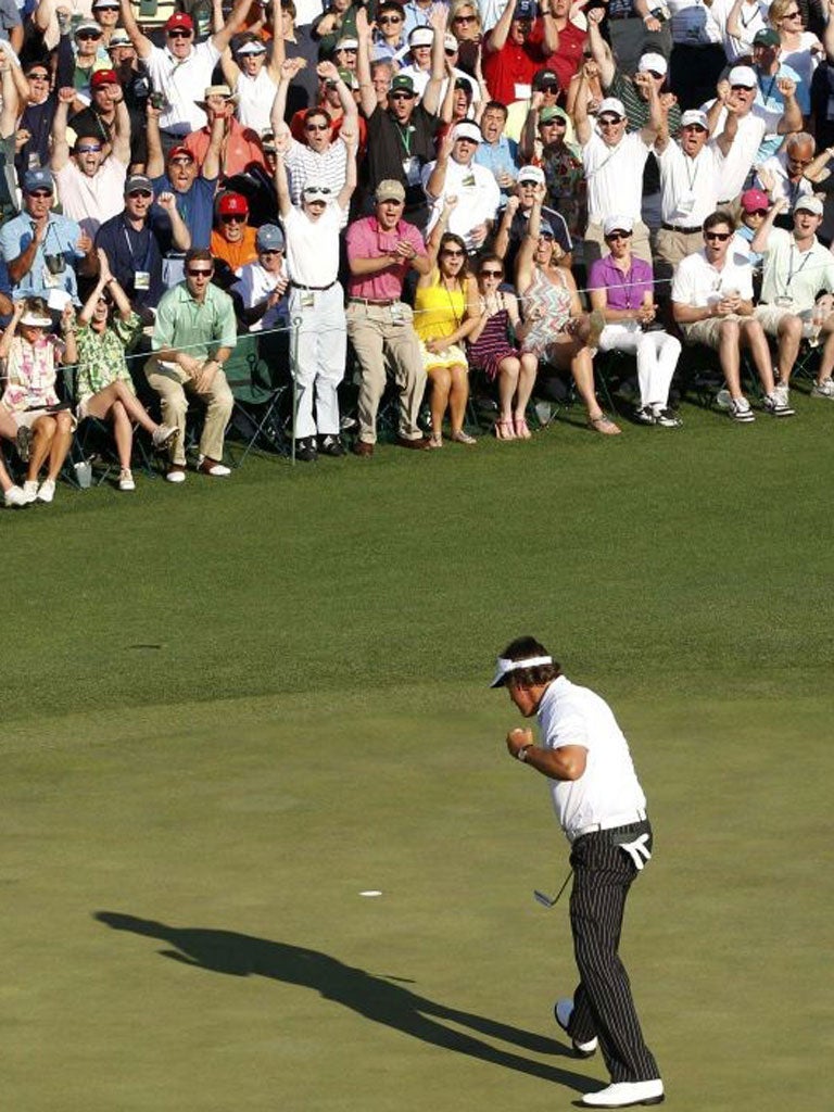The crowd on the 18th go wild as Mickelson sinks a
third-round putt