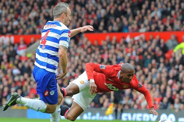 Ashley Young flies through the air to win a penalty after Shaun Derry’s minimal contact