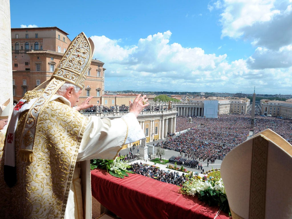 Pope Benedict XVI waves as he adress to the city and the world from a balcony in St. Peter's Square in Vatican