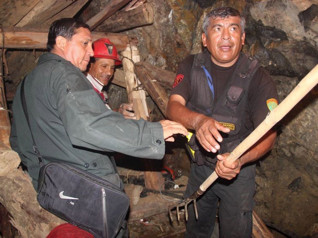Rescue workers in the collapsed mine