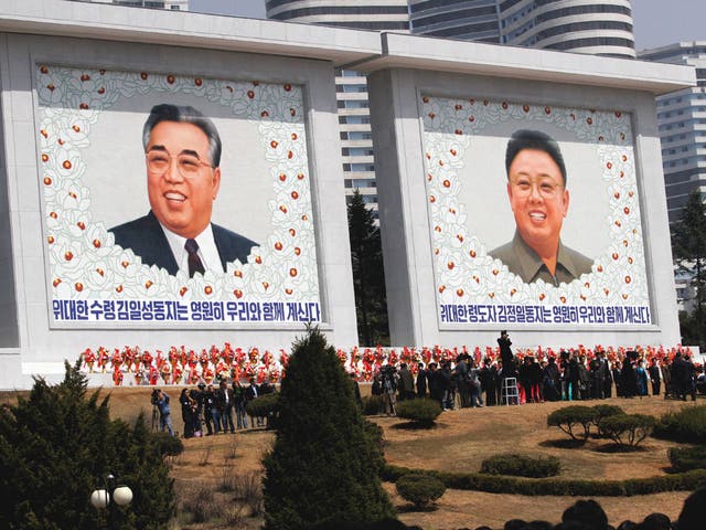 Kim Jong-il, right, and Kim Il-sung, the centenary of whose birth will be celebrated by a missile launch
