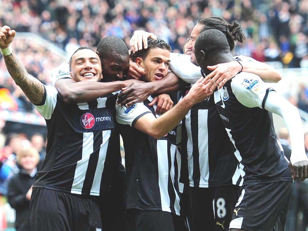 Hatem Ben Arfa (centre) is mobbed by his teammates
after scoring the opener for Newcastle