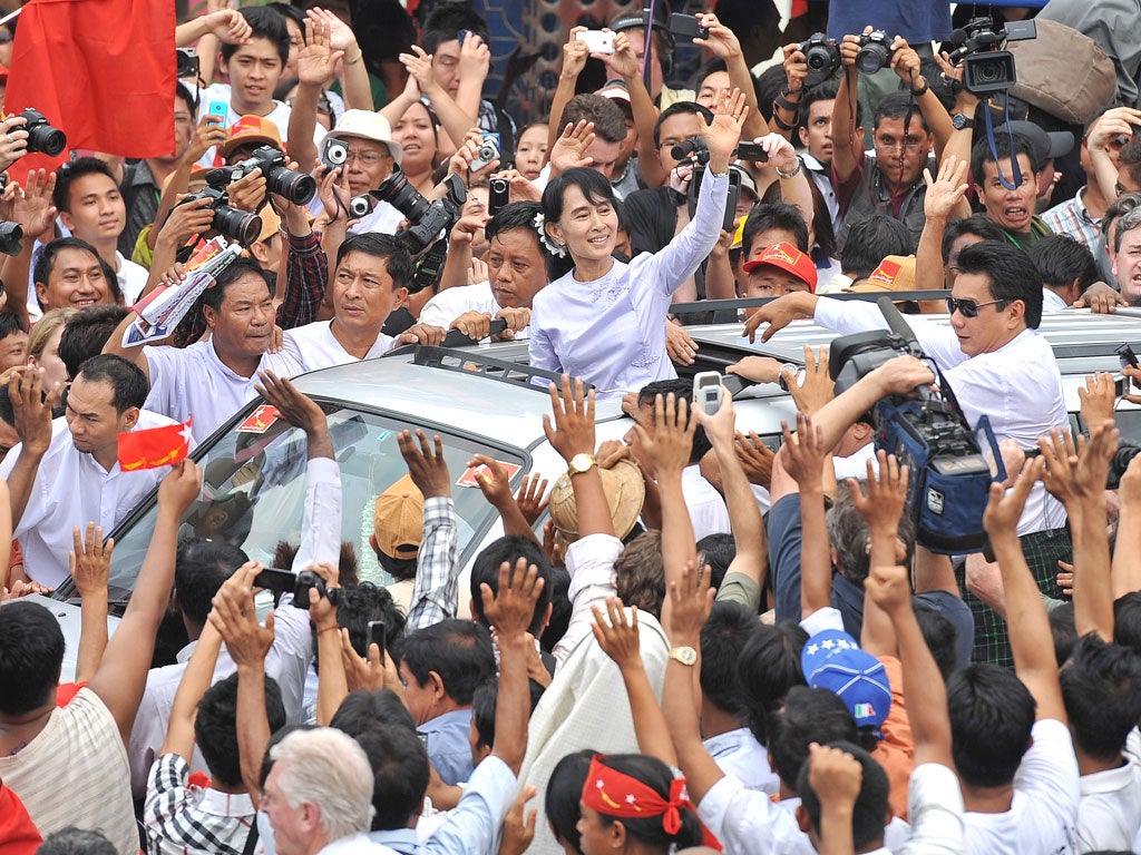Aung San Suu Kyi surrounded by supporters after her election victory on 1 April, hailed as a ‘historic result’