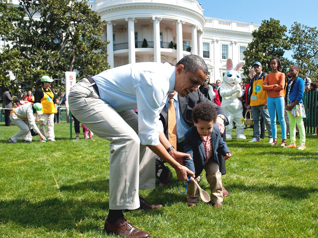 Barack Obama made an executive intervention in the
White House Easter Egg Roll yesterday, helping a little boy propel his egg to the finish line