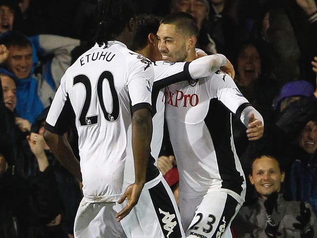 Clint Dempsey (No 23) celebrates with his Fulham team-mates after his equaliser last night