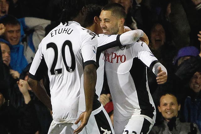 Clint Dempsey (No 23) celebrates with his Fulham team-mates after his equaliser last night