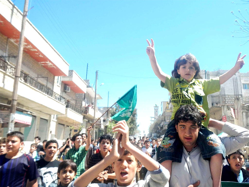 Protesters rally against President Assad in Kafranbel, near Idlib, Syria