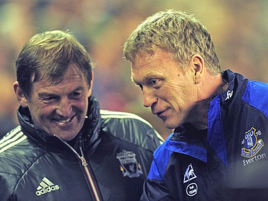 Liverpool manager Kenny Dalglish and Everton's David Moyes share a joke before their Premier League encounter last month