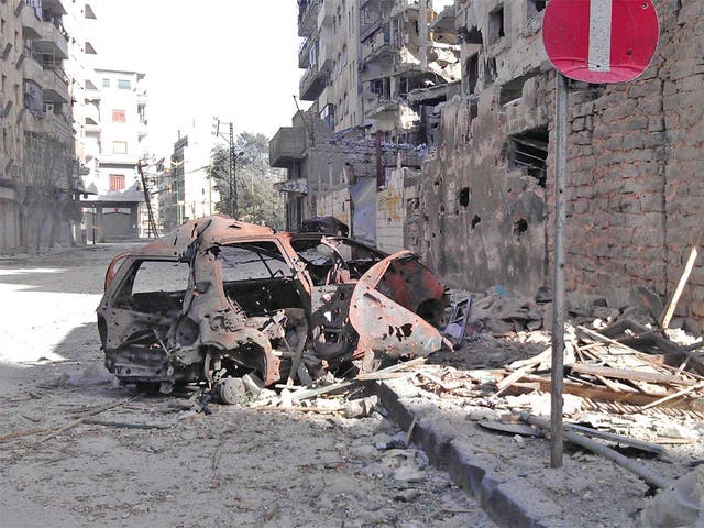 Buildings damaged by President Assad's army in the Juret al-Shayah surburb of Homs