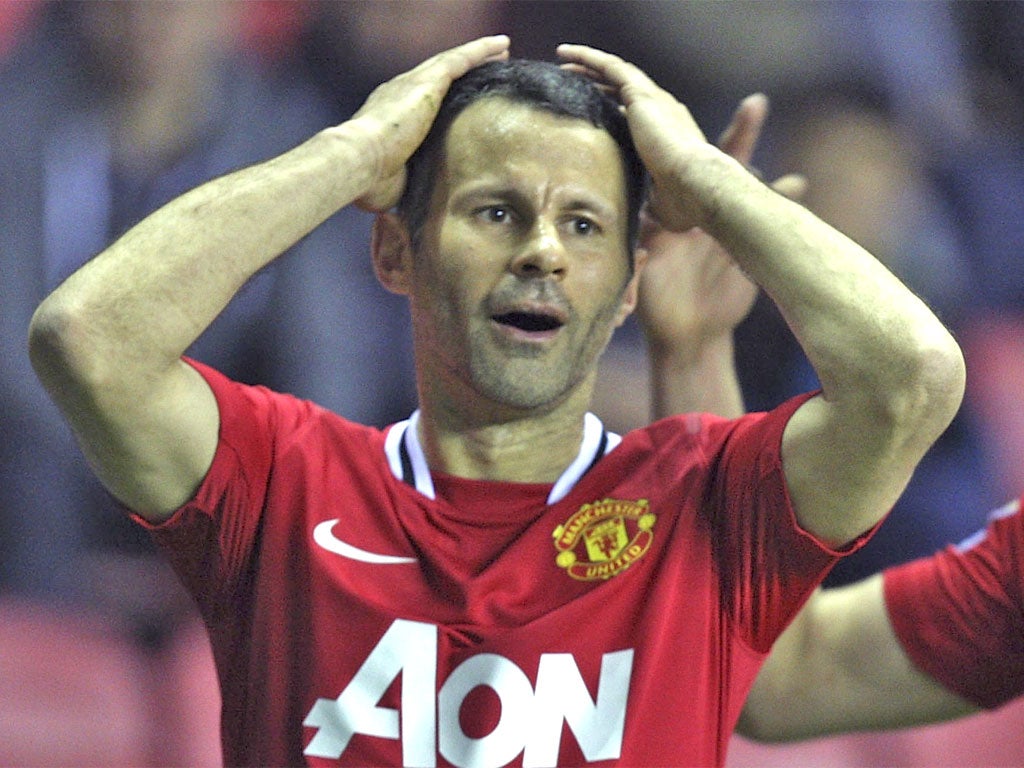 Ryan Giggs rues a missed chance during United's loss