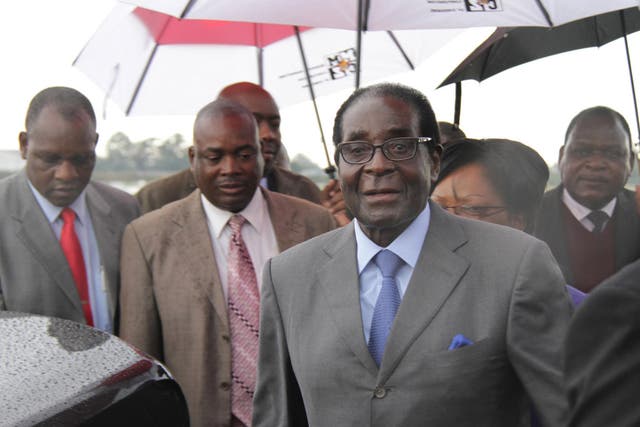 Robert Mugabe flew back from Asia to Harare yesterday, seemingly in good health