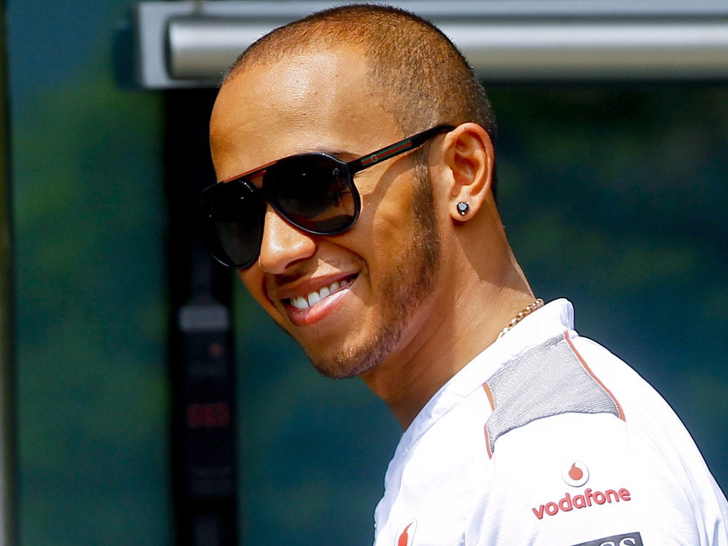 Lewis Hamilton is all smiles, despite his grid penalty