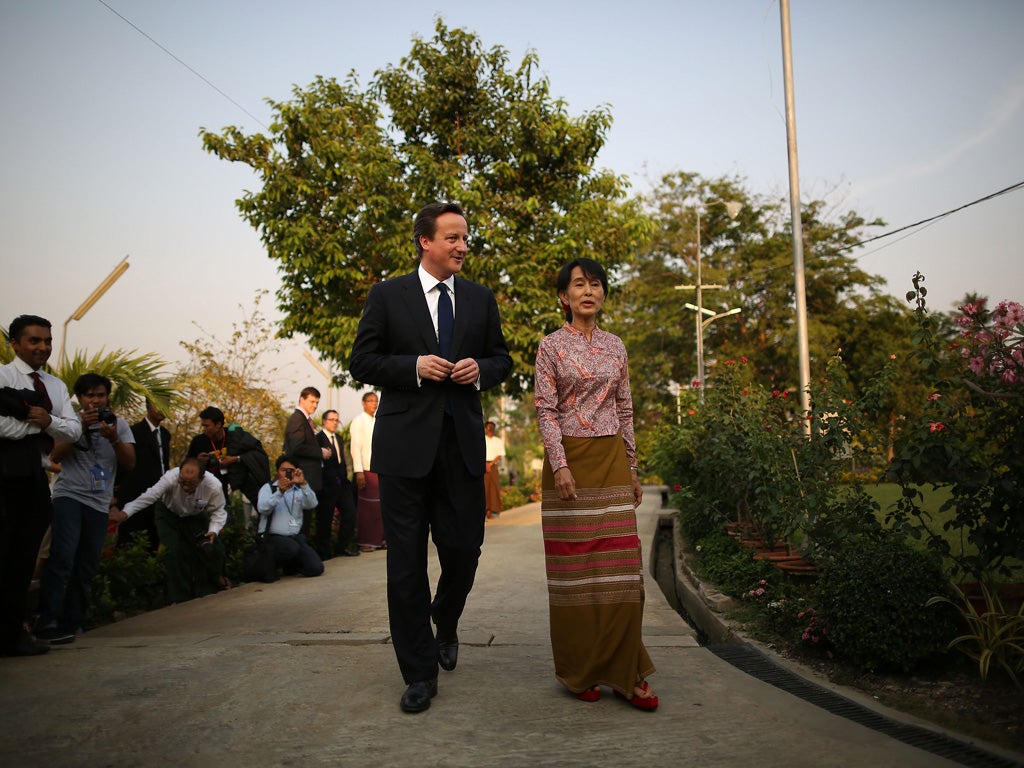 David Cameron with democracy leader Aung SanSuu Kyi in her garden yesterday