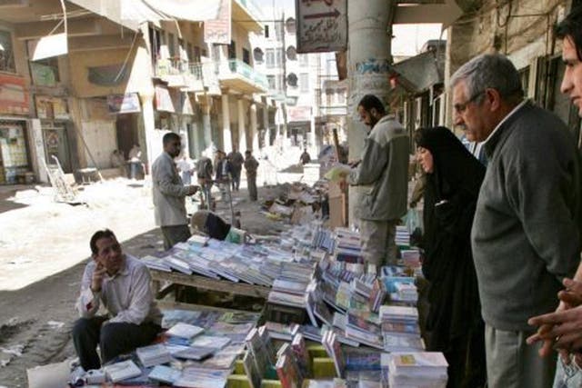 A man sells second-hand books in Mutanabbi Street in Baghdad