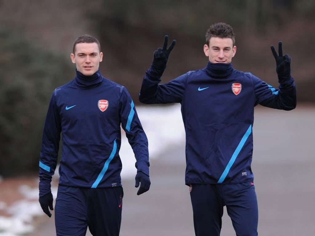 Thomas Vermaelen (left) and Laurent Koscielny have provided Arsenal with a stable defensive platform