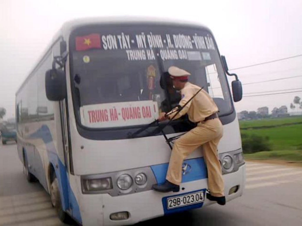 ‘Tickets, please’: provided you can avoid the ubiquitous motorcyclists and Vietnam’s notoriously persistent traffic wardens, bus travel is the best way to get to the Cambodian capital