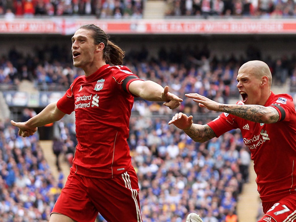 Andy Carroll celebrates with Martin Skrtel