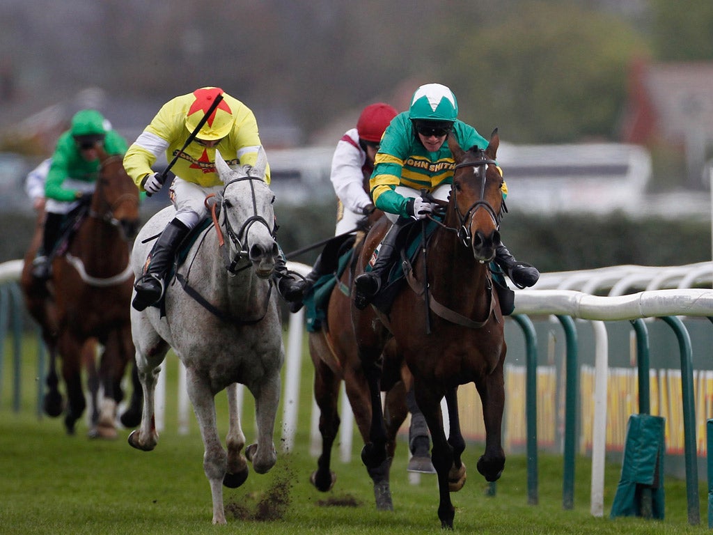 Daryl Jacob riding Neptune Collonges (grey horse) on their way to winning The John Smith's Grand National from Sunnyhillboy and Richie McLernon