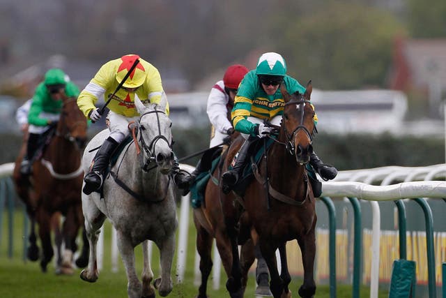 Daryl Jacob riding Neptune Collonges (grey horse) on their way to winning The John Smith's Grand National from Sunnyhillboy and Richie McLernon