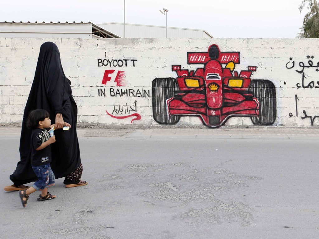 Graffiti shows the anger of protesters at Formula One's return to Bahrain after the cancellation of last year's Grand Prix