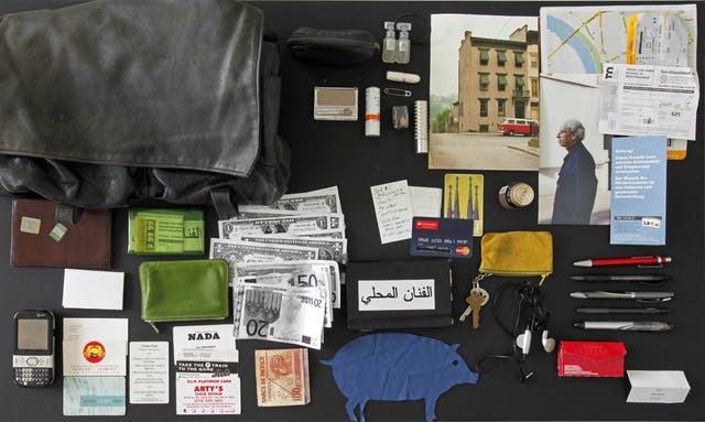 Awoman's bag and its contents, arranged by Feldmann, who bought the lot from its owner