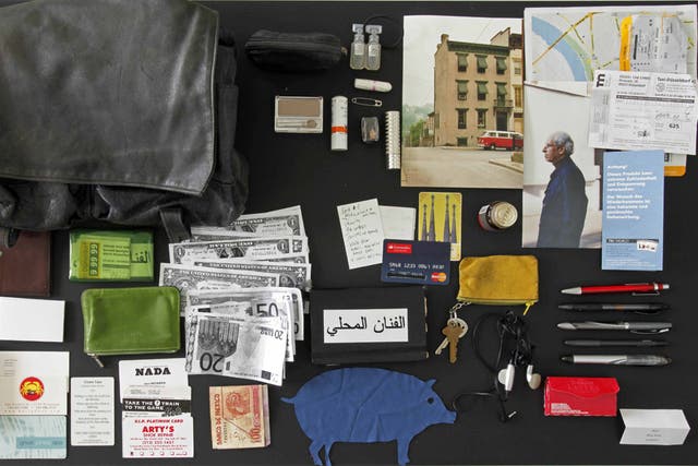Awoman's bag and its contents, arranged by Feldmann, who bought the lot from its owner