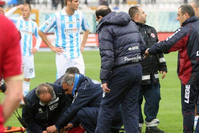 Livorno midfielder Piermario Morosini was treated by medics when he collapsed on the pitch, in a scene that echoes last month's incident with Bolton's Fabrice Muamba