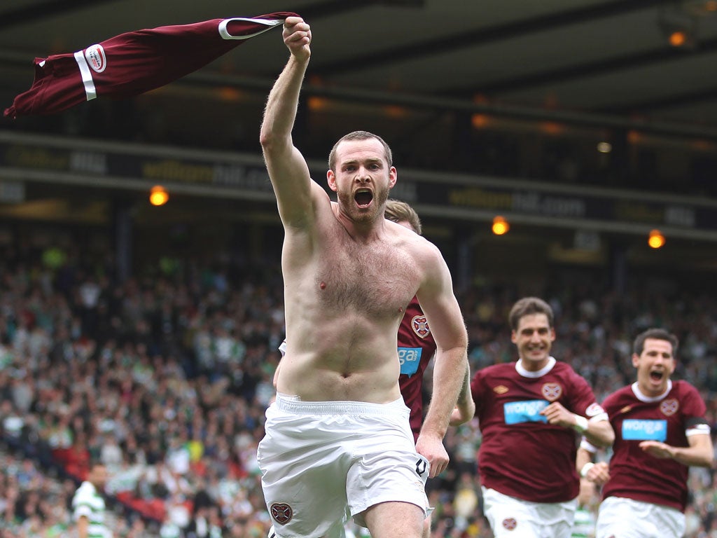 Hearts’ Craig Beattie goes topless to celebrate scoring
the winner against Celtic in yesterday’s semi-final