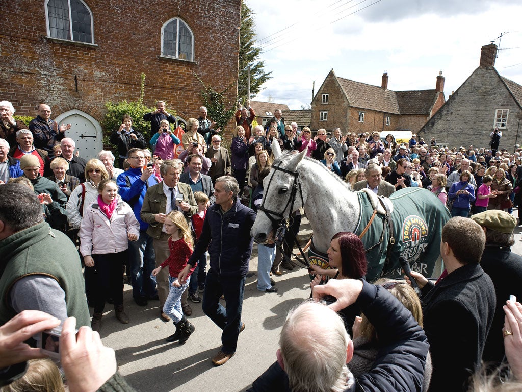Neptune Collonges is paraded in triumph in Ditcheat village yesterday