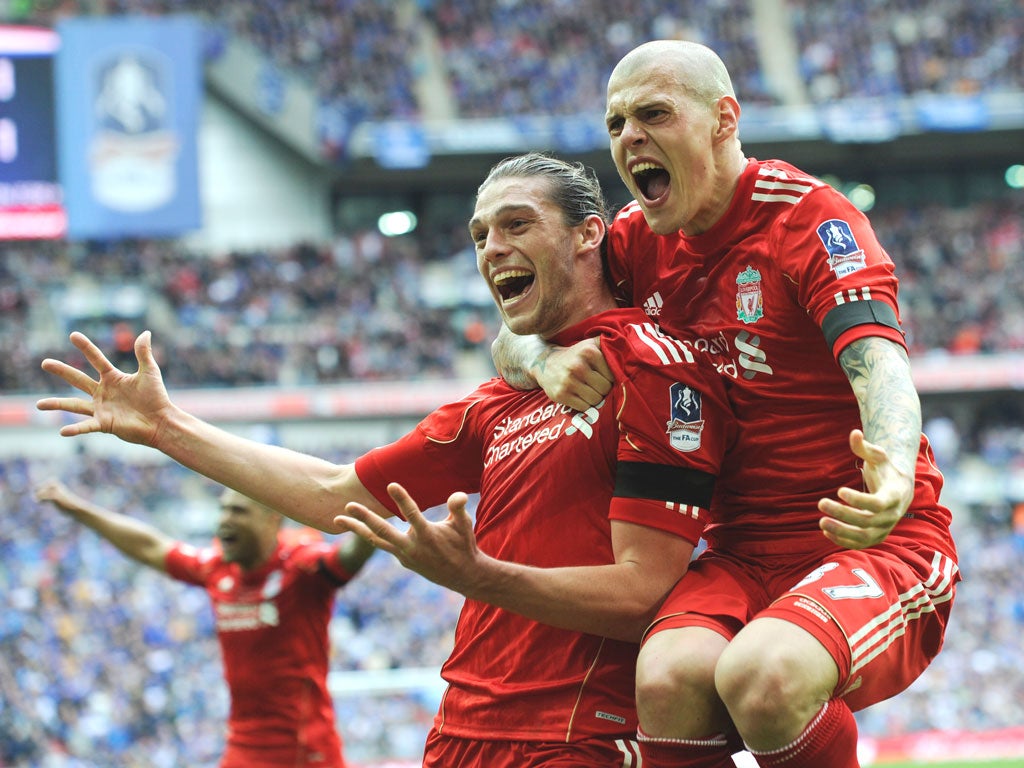 Martin Skrtel (right) congratulates Liverpool team-mate Andy Carroll after his late winner