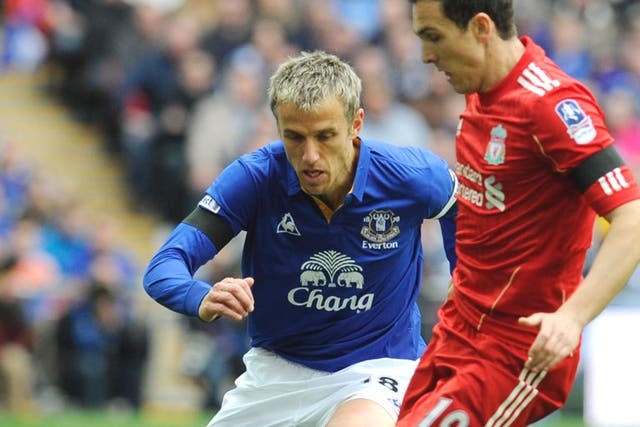 Everton’s Phil Neville closes down Stewart Downing on Saturday